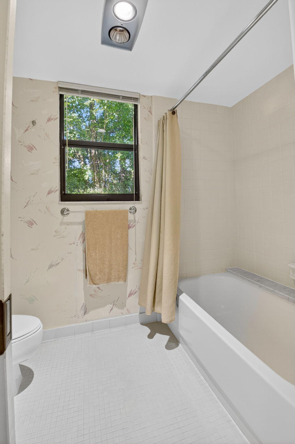 20249 Boca W Drive, Unit 2605 Boca Raton, FL 33434 - Photo 22 of 85 a bathroom with a tub and a window