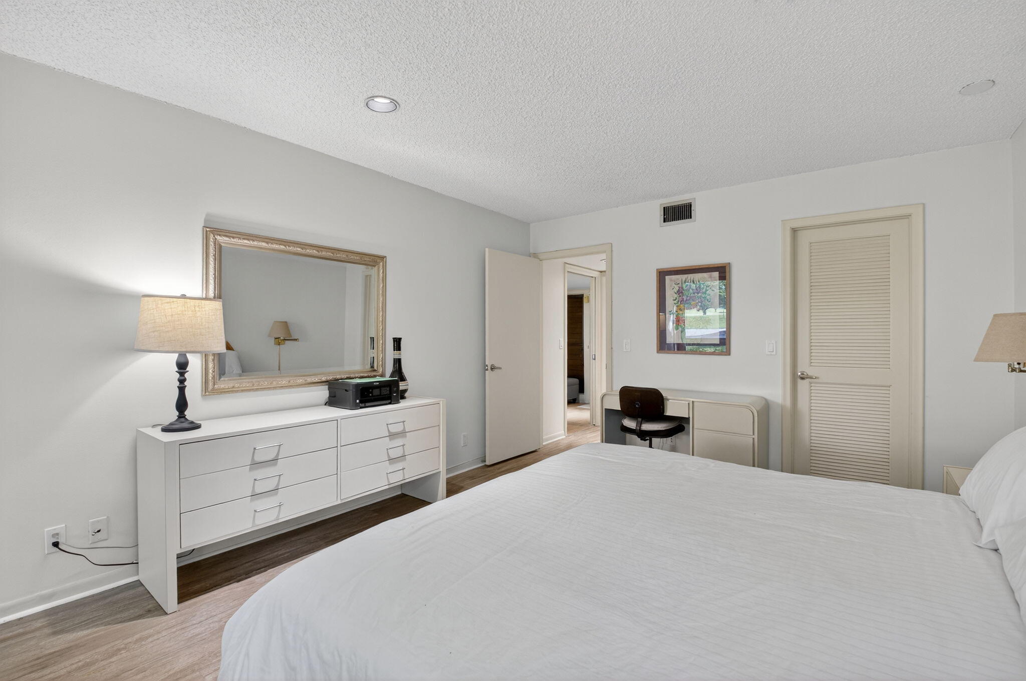 20249 Boca W Drive, Unit 2605 Boca Raton, FL 33434 - Photo 25 of 85 a bedroom with a bed and a large mirror