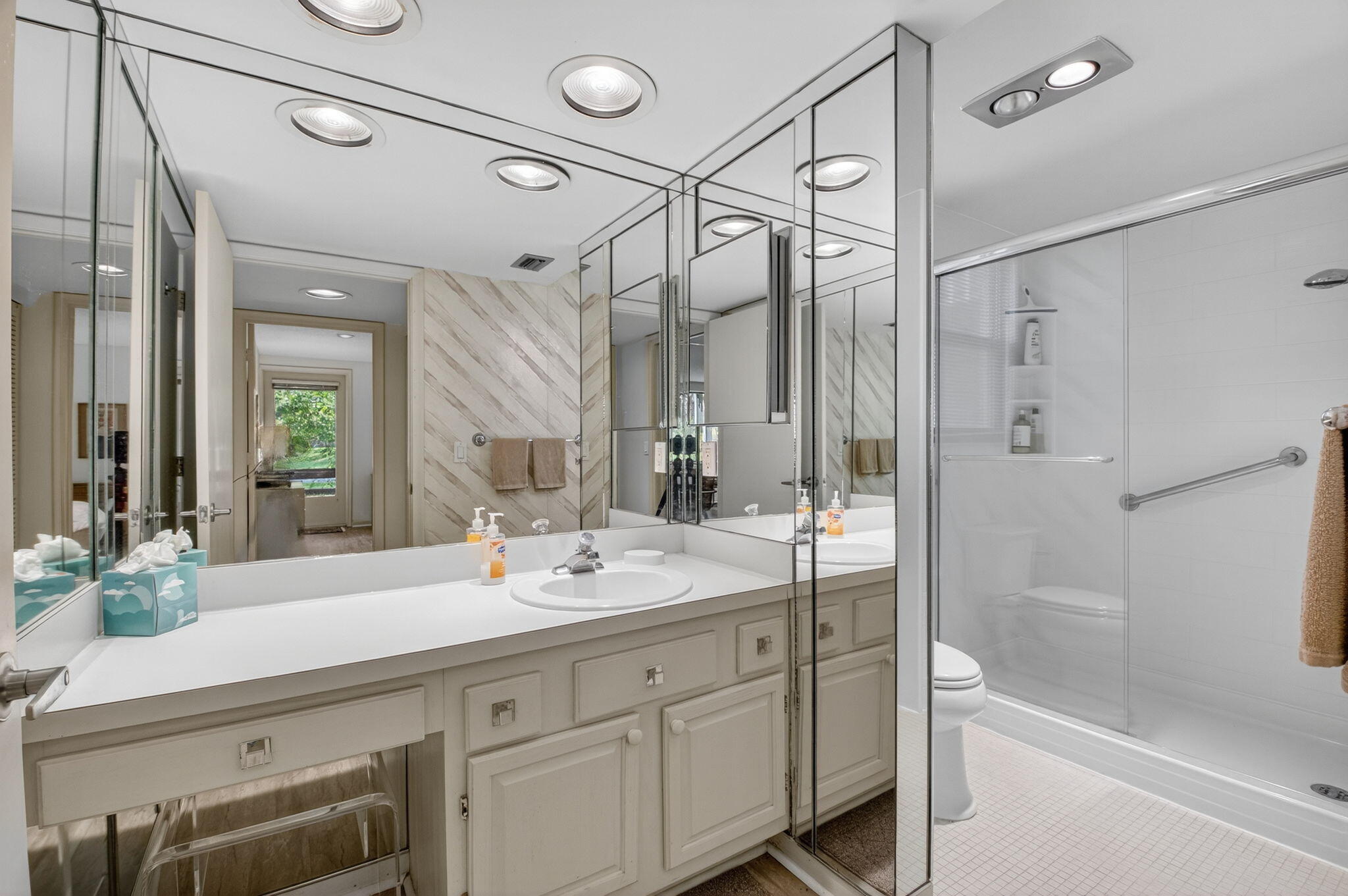 20249 Boca W Drive, Unit 2605 Boca Raton, FL 33434 - Photo 27 of 85 a bathroom with a double vanity sink mirror double and shower