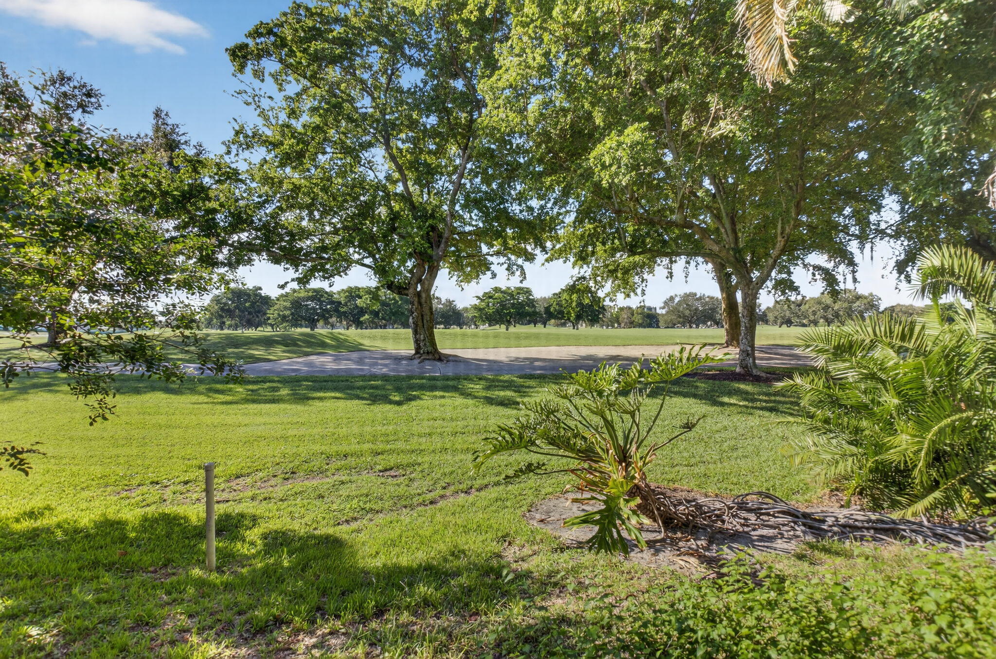 20249 Boca W Drive, Unit 2605 Boca Raton, FL 33434 - Photo 32 of 85 a view of a garden with a tree