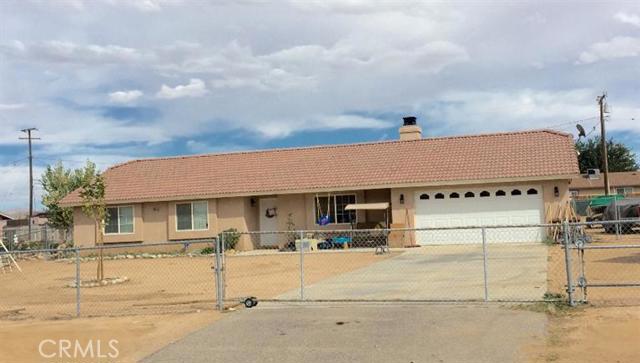 10849 Nambe Road Apple Valley, CA 92308 - Photo 1 of 1 a front view of a house with garage