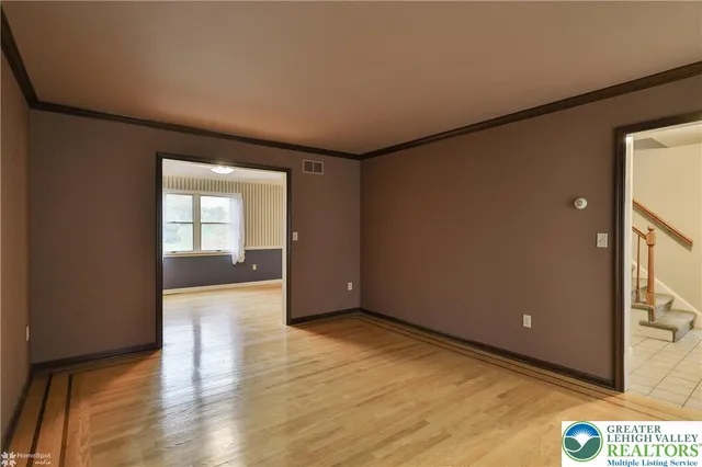 a view of an empty room and glass door
