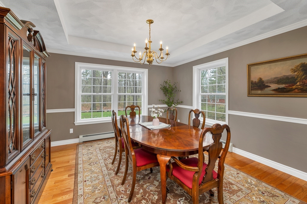 9 Juniper Ridge Road Exeter, NH 03833 - Photo 15 of 41 a view of a dining room with furniture window and outside view