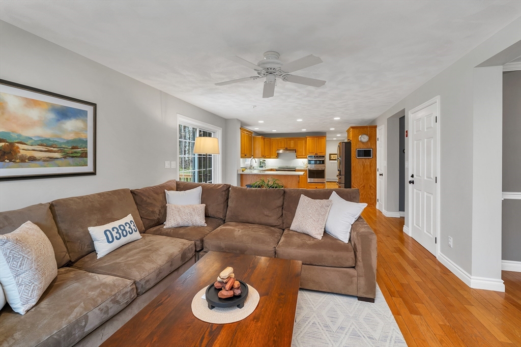 9 Juniper Ridge Road Exeter, NH 03833 - Photo 19 of 41 a living room with furniture and a large window
