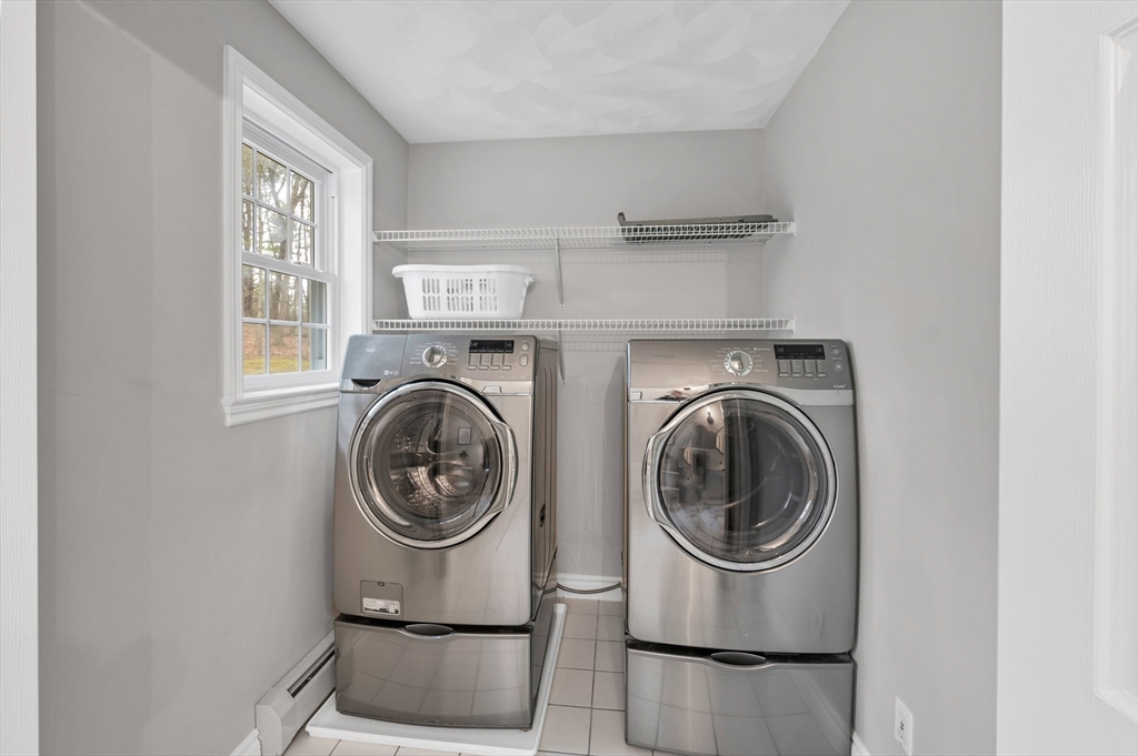 9 Juniper Ridge Road Exeter, NH 03833 - Photo 21 of 41 a view of washer and dryer in a utility room