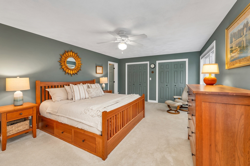 9 Juniper Ridge Road Exeter, NH 03833 - Photo 28 of 41 a bed room with a bed and a lamp