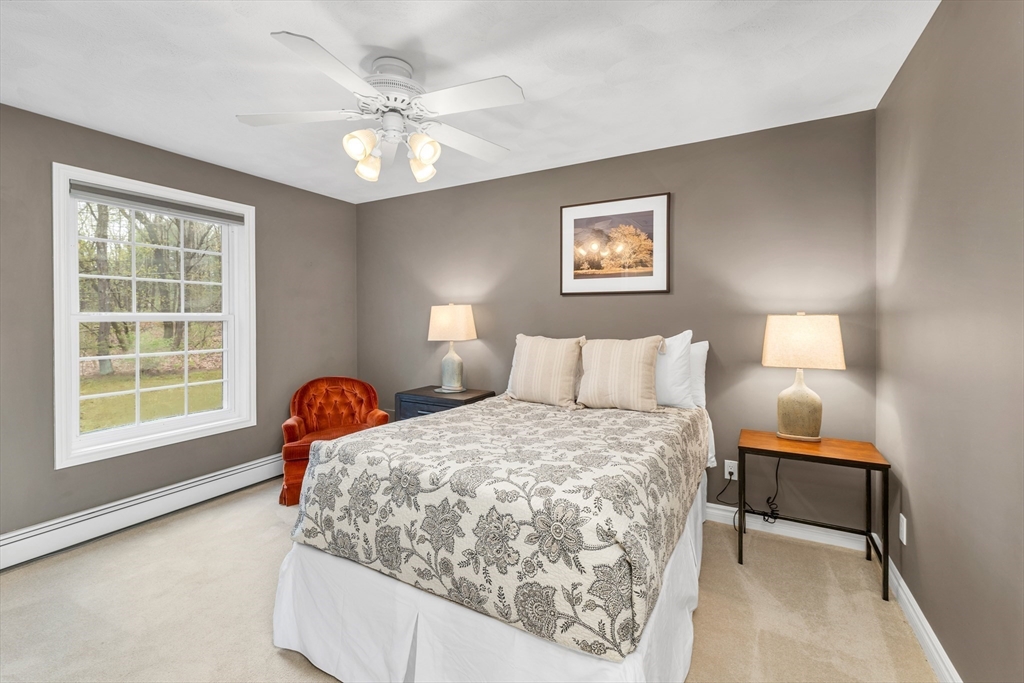 9 Juniper Ridge Road Exeter, NH 03833 - Photo 33 of 41 a bedroom with a bed and a large window