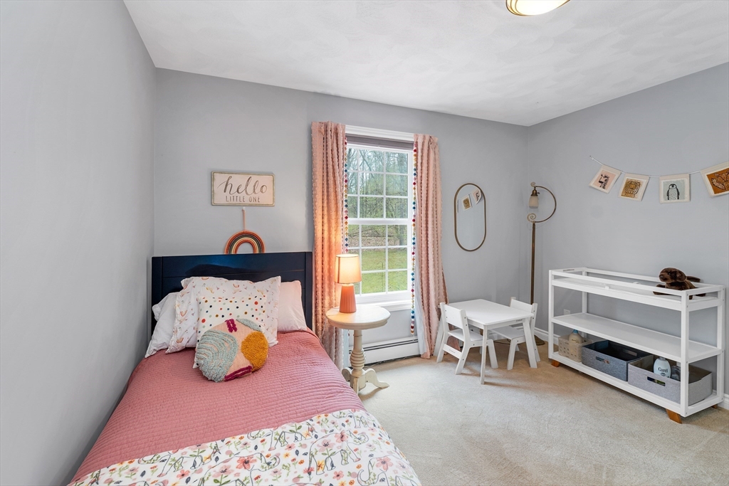 9 Juniper Ridge Road Exeter, NH 03833 - Photo 39 of 41 a bed room with a bed and a table