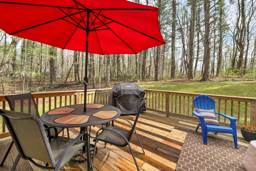 9 Juniper Ridge Road Exeter, NH 03833 - Photo 40 of 41 a view of a patio with a table and chairs under an umbrella