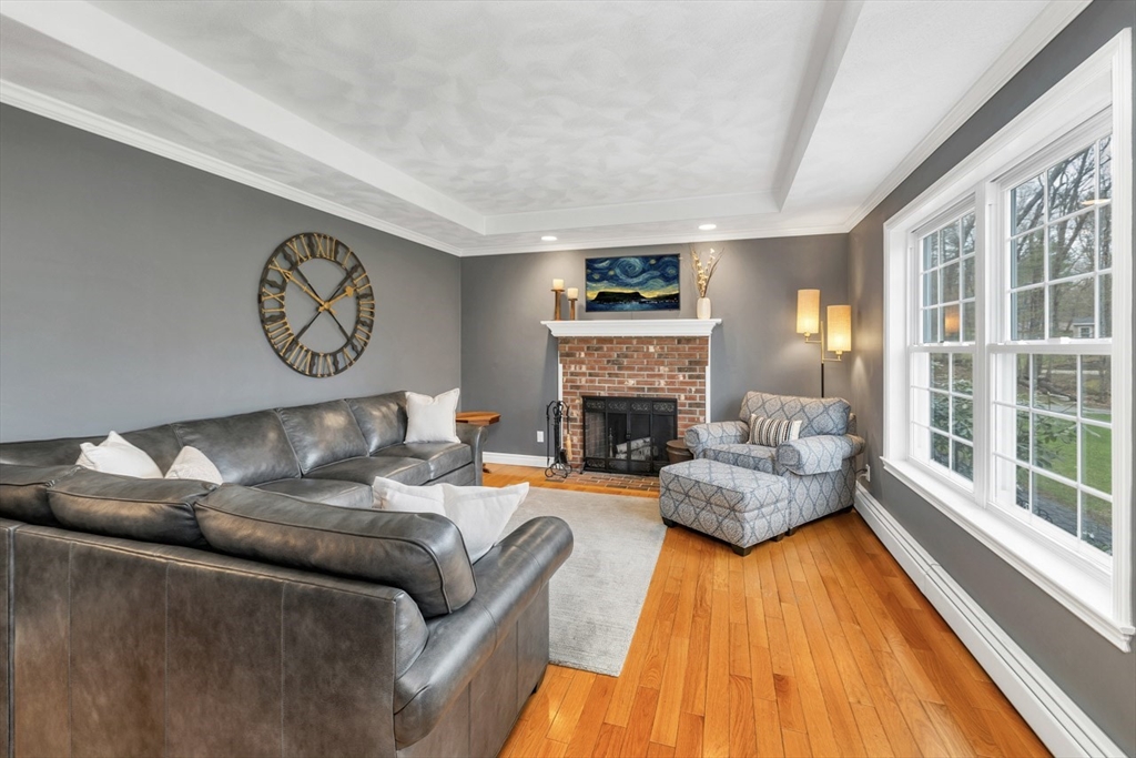 9 Juniper Ridge Road Exeter, NH 03833 - Photo 4 of 41 a living room with furniture and a fireplace