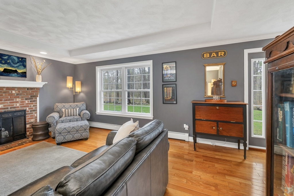 9 Juniper Ridge Road Exeter, NH 03833 - Photo 5 of 41 a living room with furniture and a fireplace