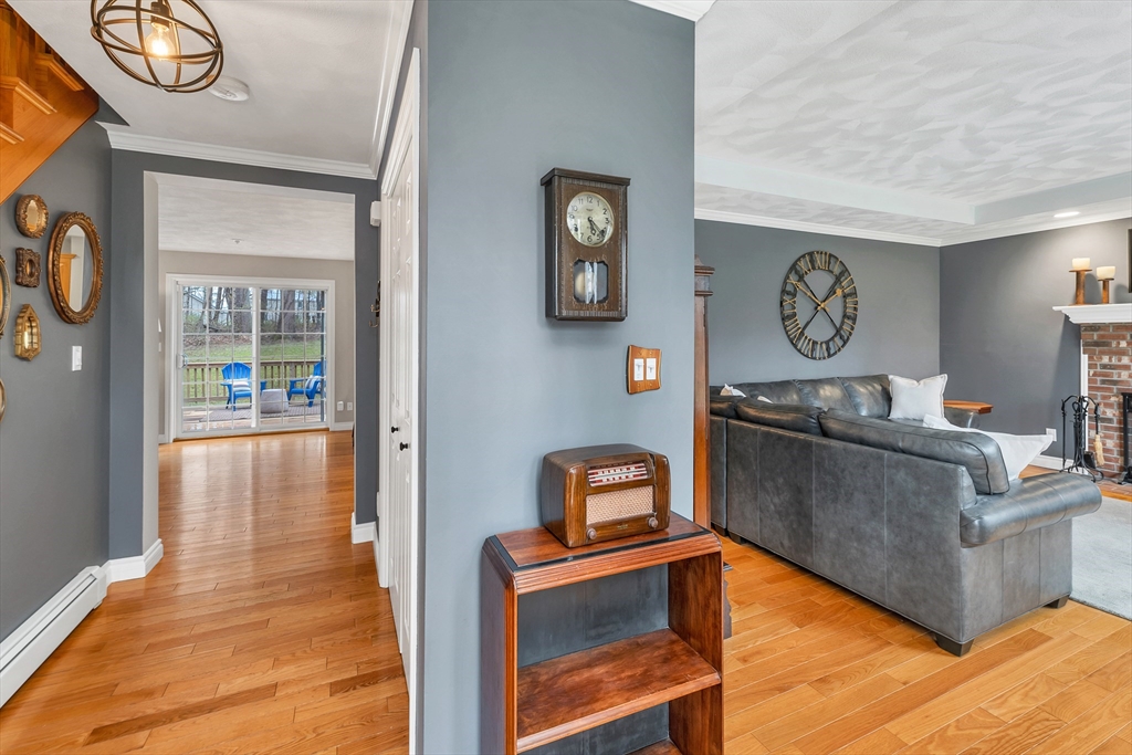 9 Juniper Ridge Road Exeter, NH 03833 - Photo 9 of 41 a living room with furniture and a flat screen tv