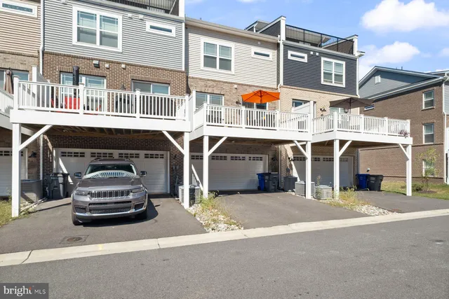 a front view of a building with parking space