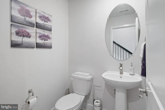 a bathroom with a toilet and sink