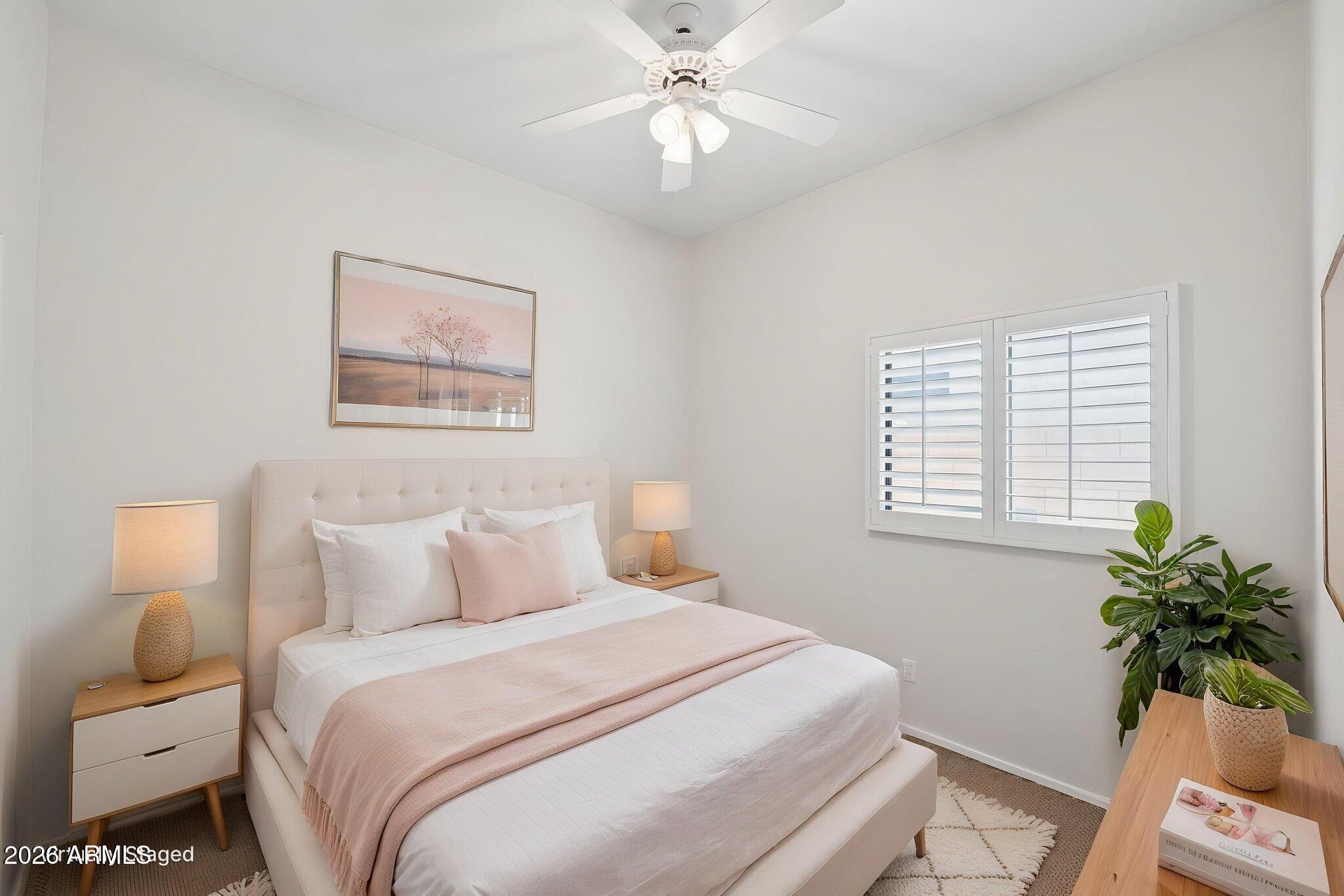 4418 East Jaeger Road Phoenix, AZ 85050 - Photo 24 of 42 a bedroom with a bed and a window