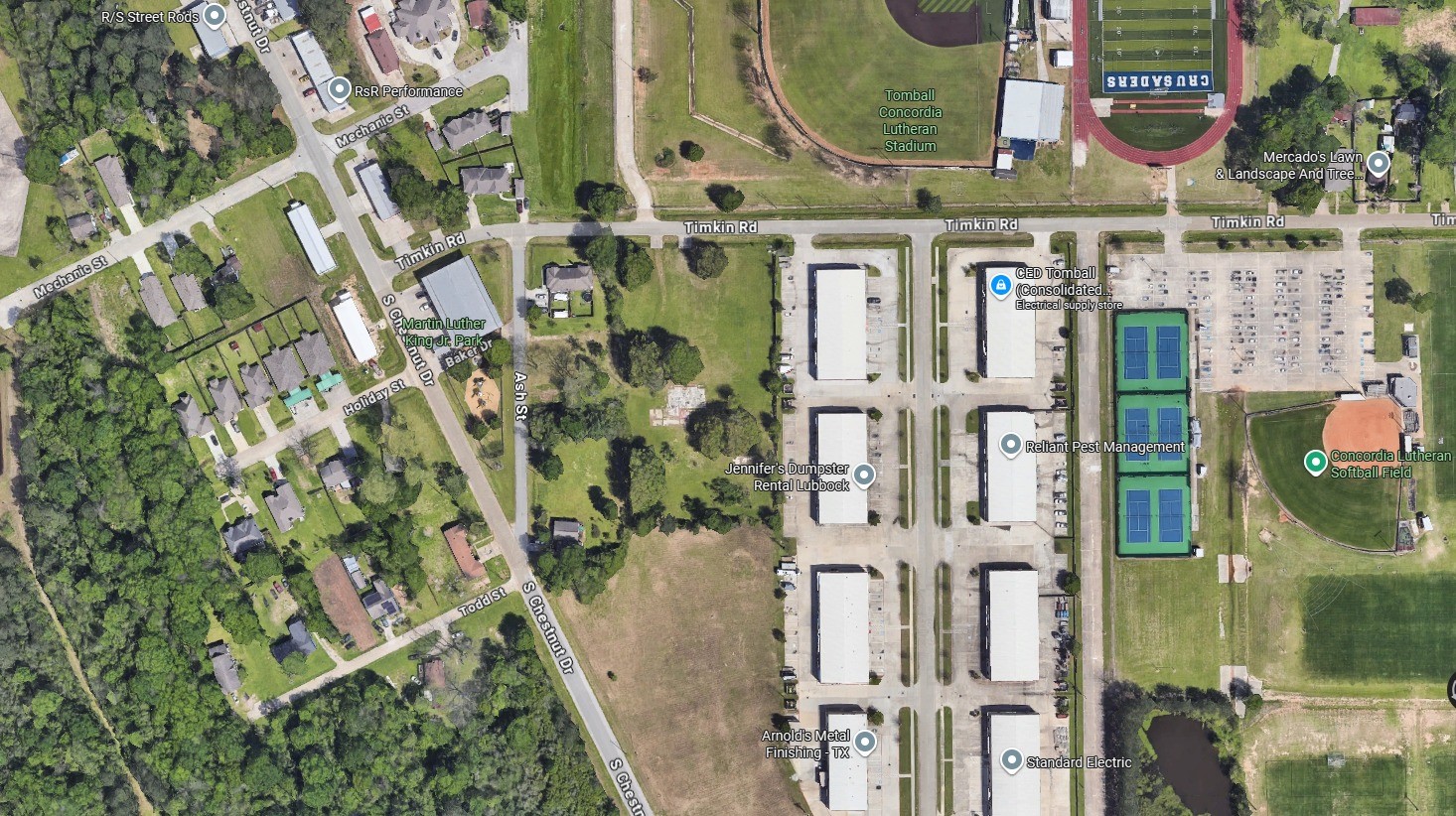 0 Ash Street Tomball, TX 77375 - Photo 2 of 2 aerial view of a residential apartment building with a yard
