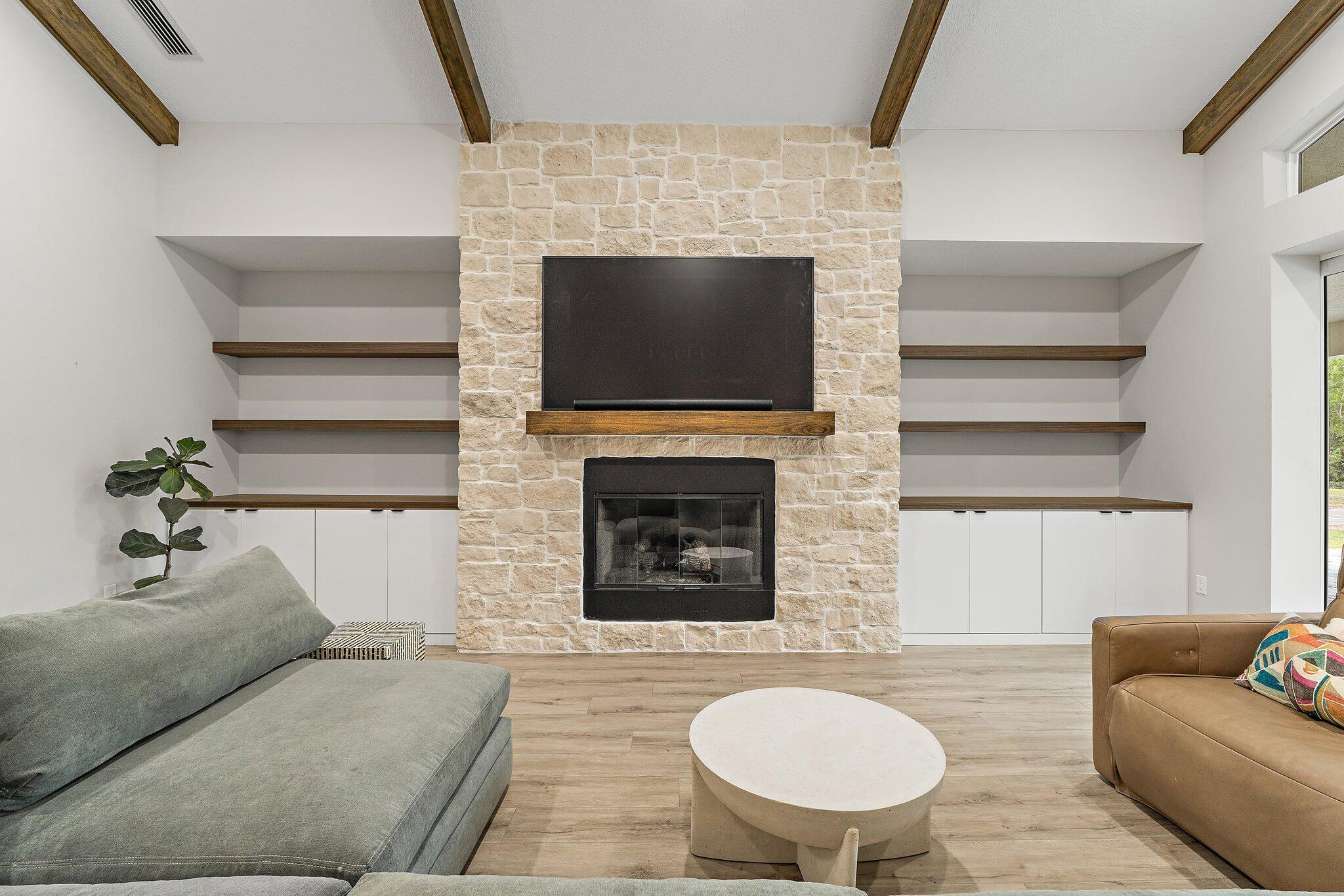 12216 175th Road North Jupiter, FL 33478 - Photo 12 of 57 a living room with furniture and a fireplace