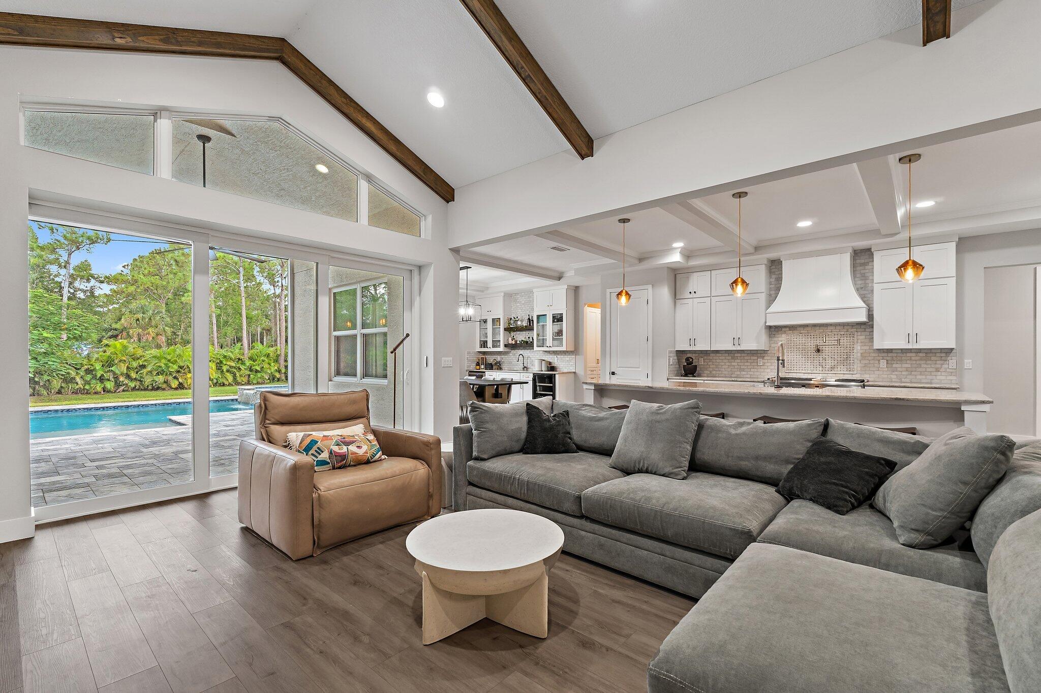 12216 175th Road North Jupiter, FL 33478 - Photo 14 of 57 a living room with furniture and a large window