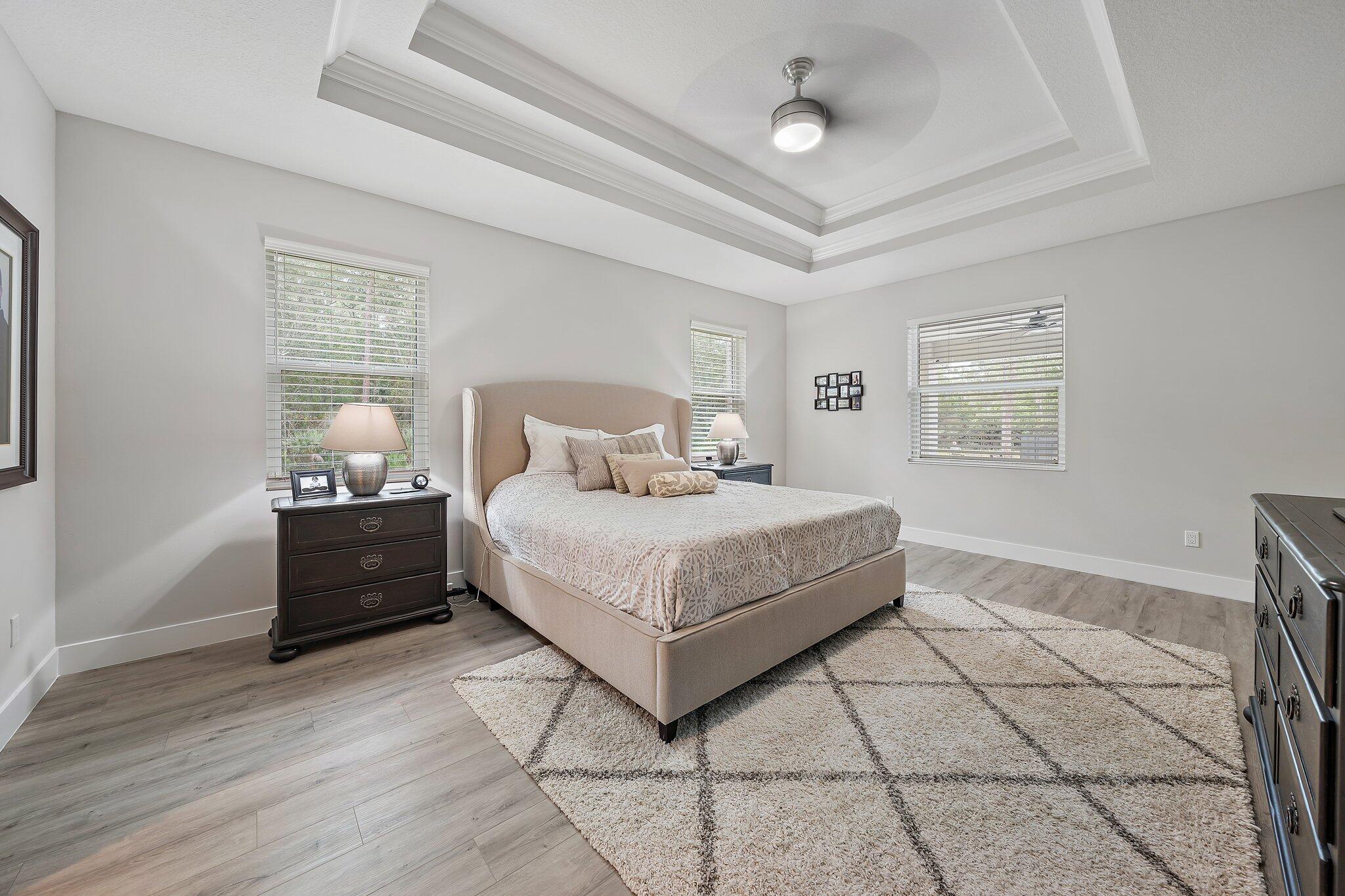 12216 175th Road North Jupiter, FL 33478 - Photo 24 of 57 a bedroom with a bed and window