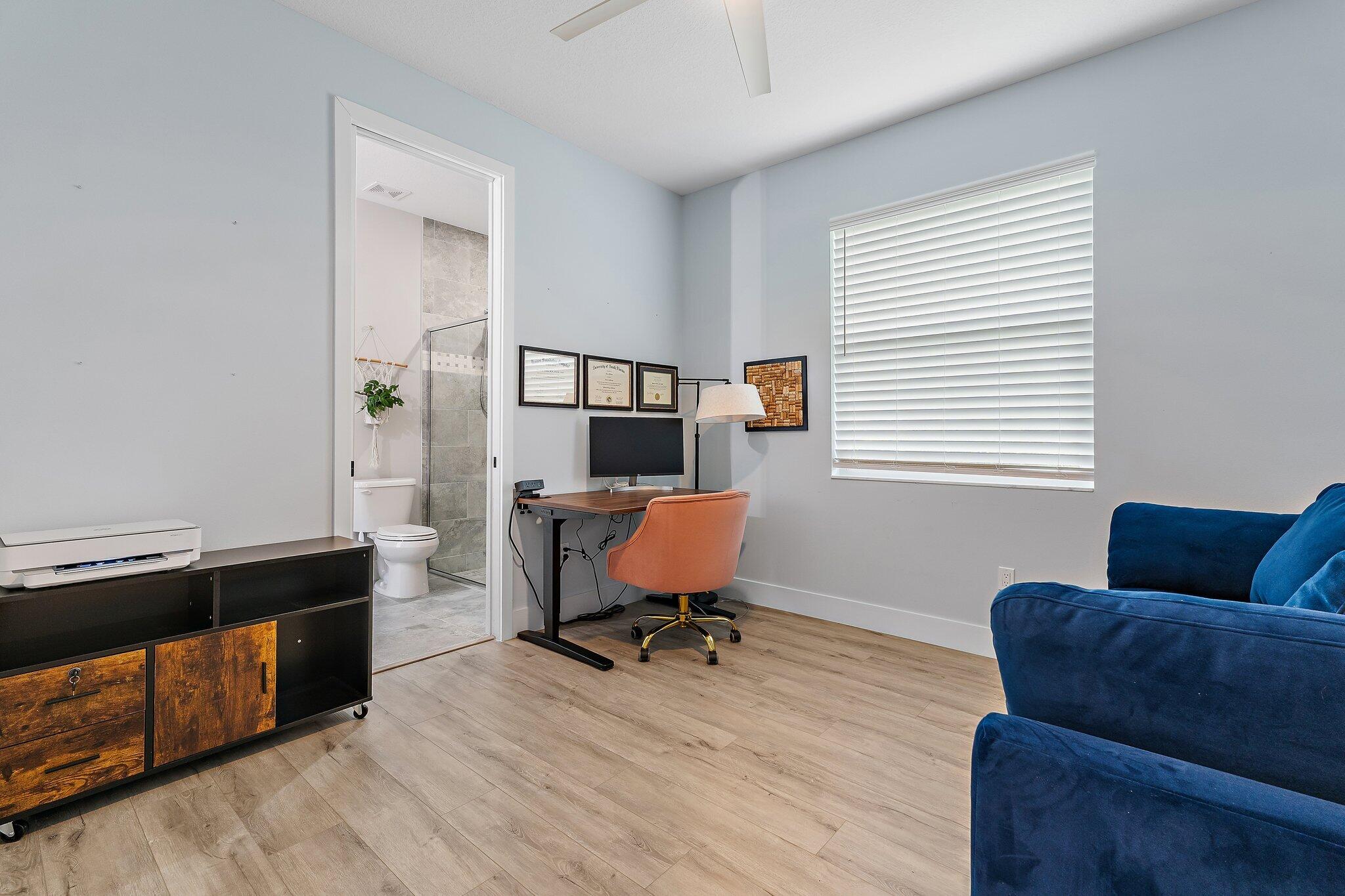 12216 175th Road North Jupiter, FL 33478 - Photo 33 of 57 a living room with furniture and a window