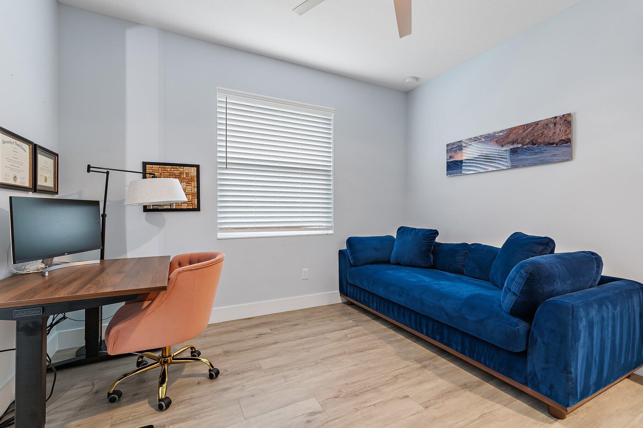 12216 175th Road North Jupiter, FL 33478 - Photo 34 of 57 a living room with furniture and a flat screen tv