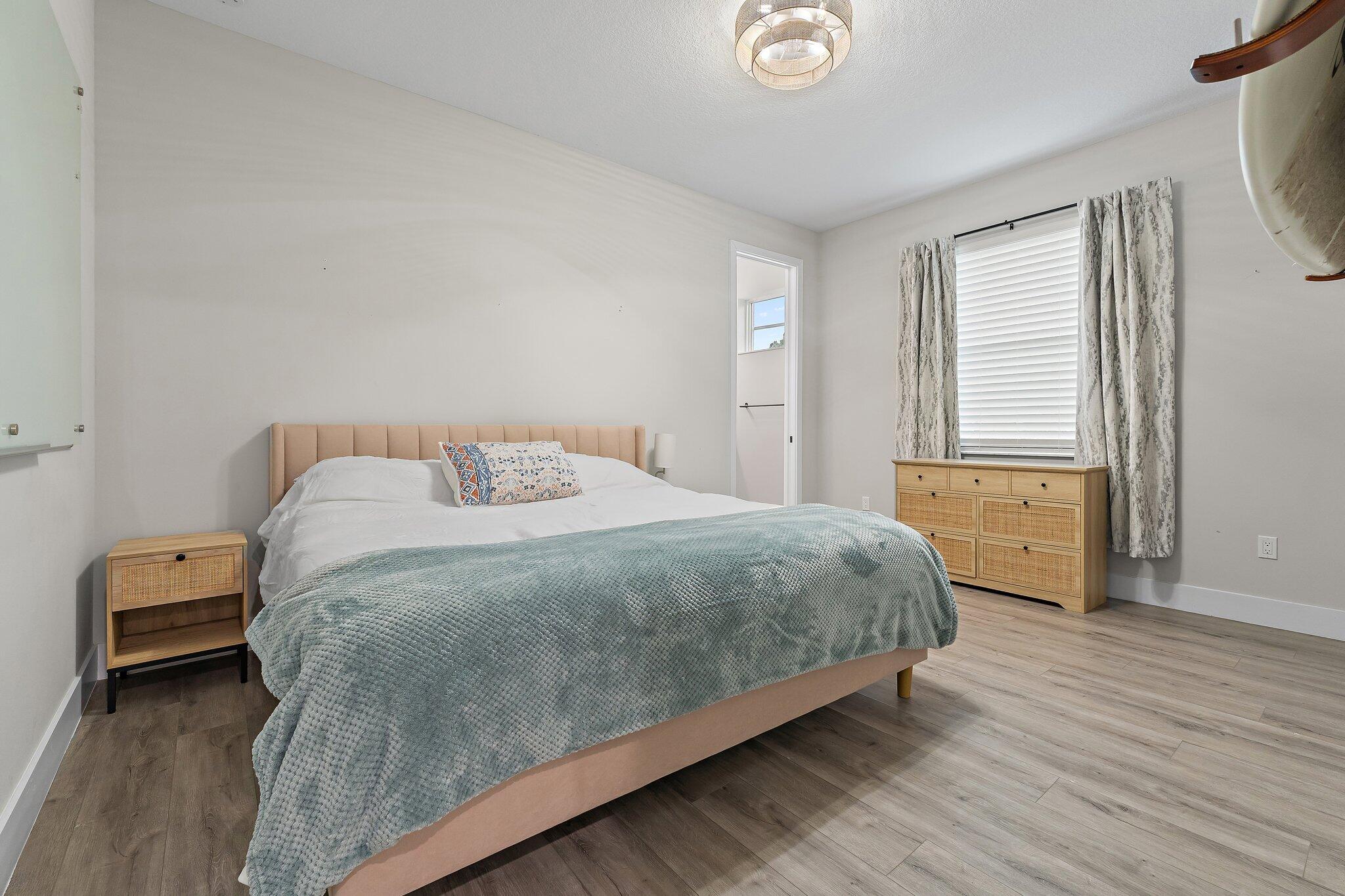 12216 175th Road North Jupiter, FL 33478 - Photo 36 of 57 a bedroom with a bed and a window