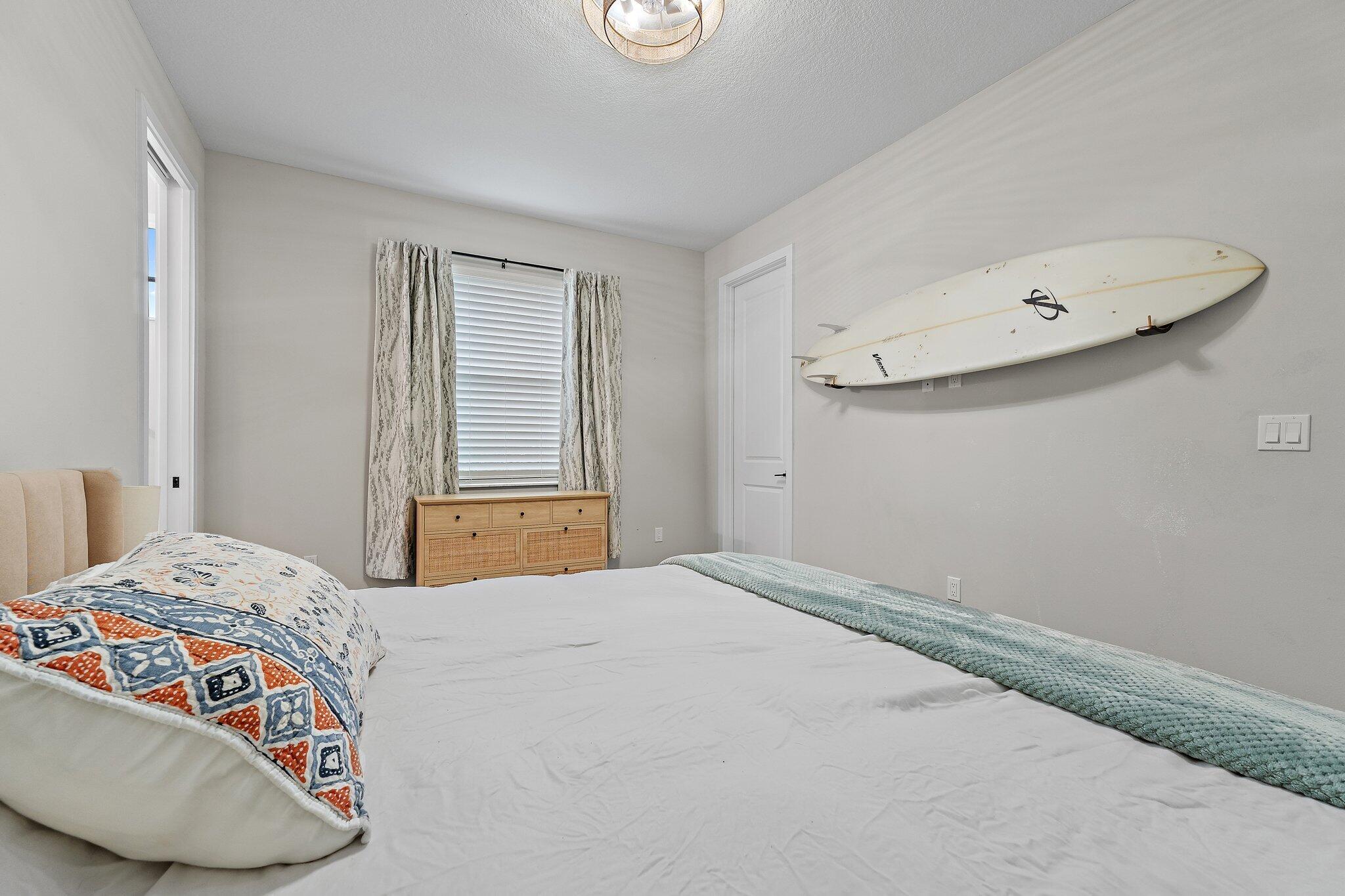 12216 175th Road North Jupiter, FL 33478 - Photo 37 of 57 a bedroom with a bed and a window