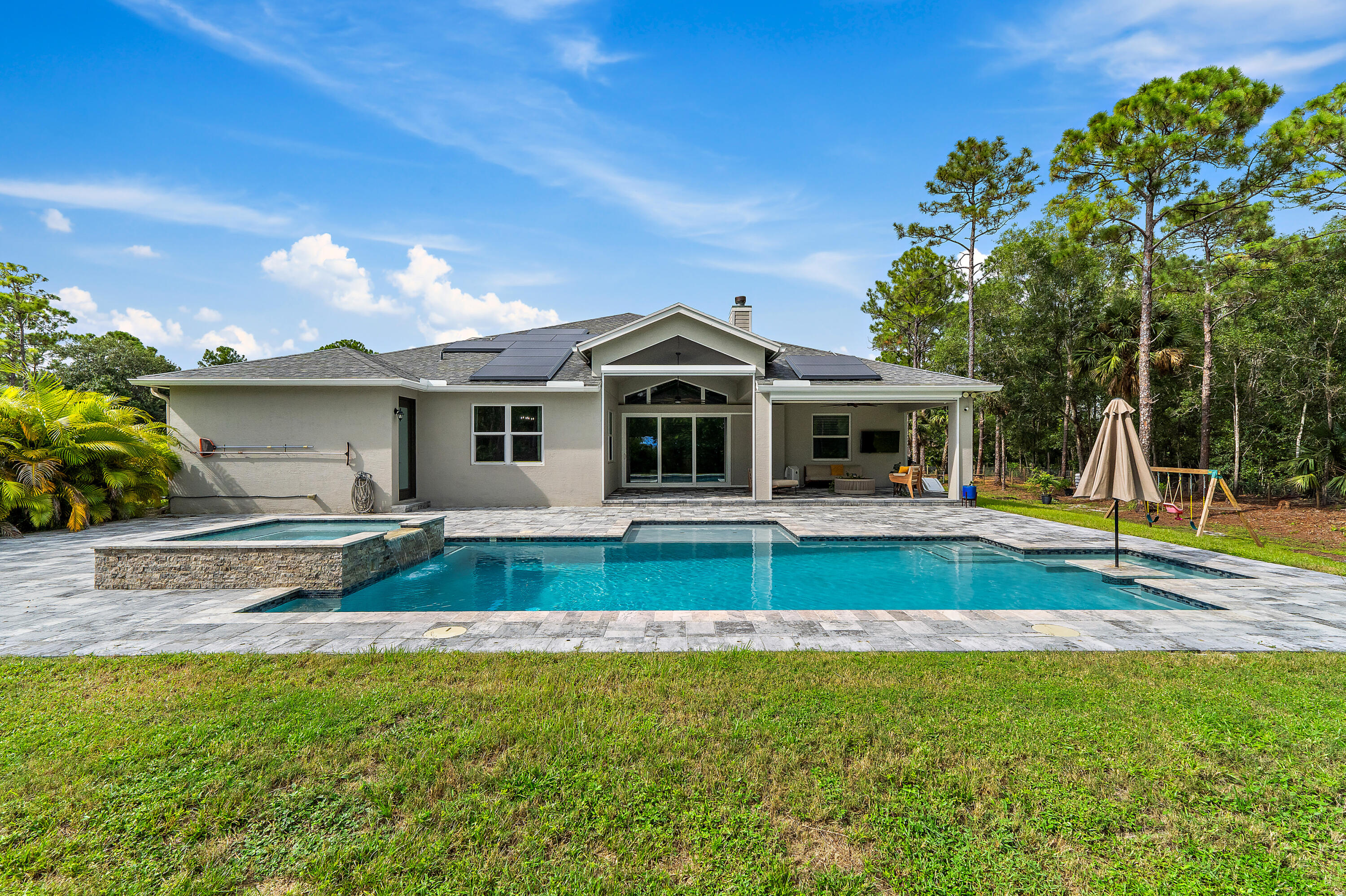 12216 175th Road North Jupiter, FL 33478 - Photo 4 of 57 a view of a house with a backyard and a small yard