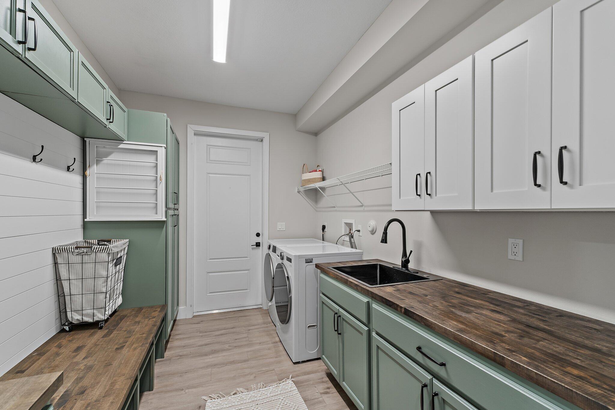 12216 175th Road North Jupiter, FL 33478 - Photo 42 of 57 a kitchen with stainless steel appliances granite countertop a sink stove and cabinets