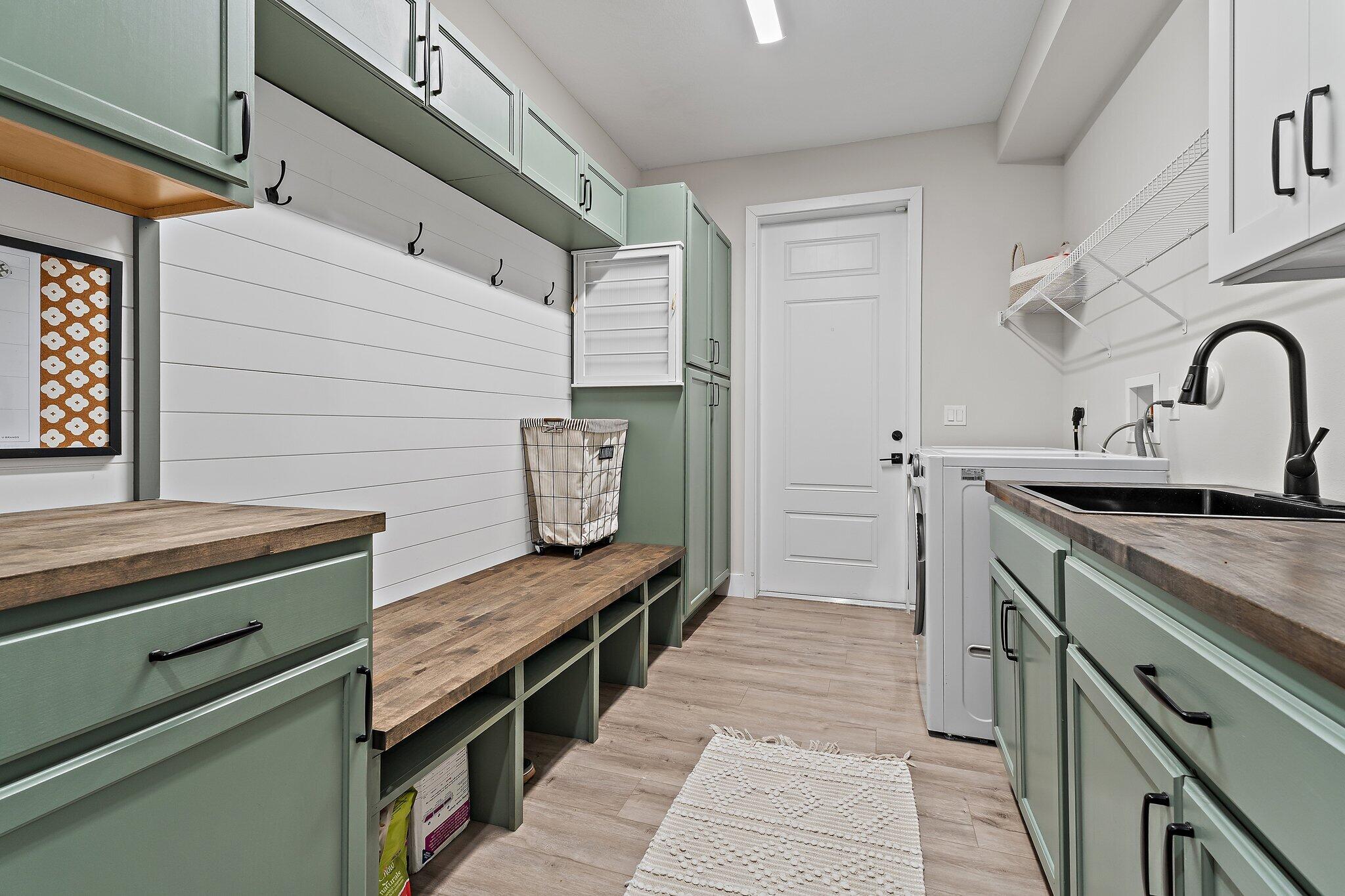12216 175th Road North Jupiter, FL 33478 - Photo 43 of 57 a kitchen with a sink and cabinets
