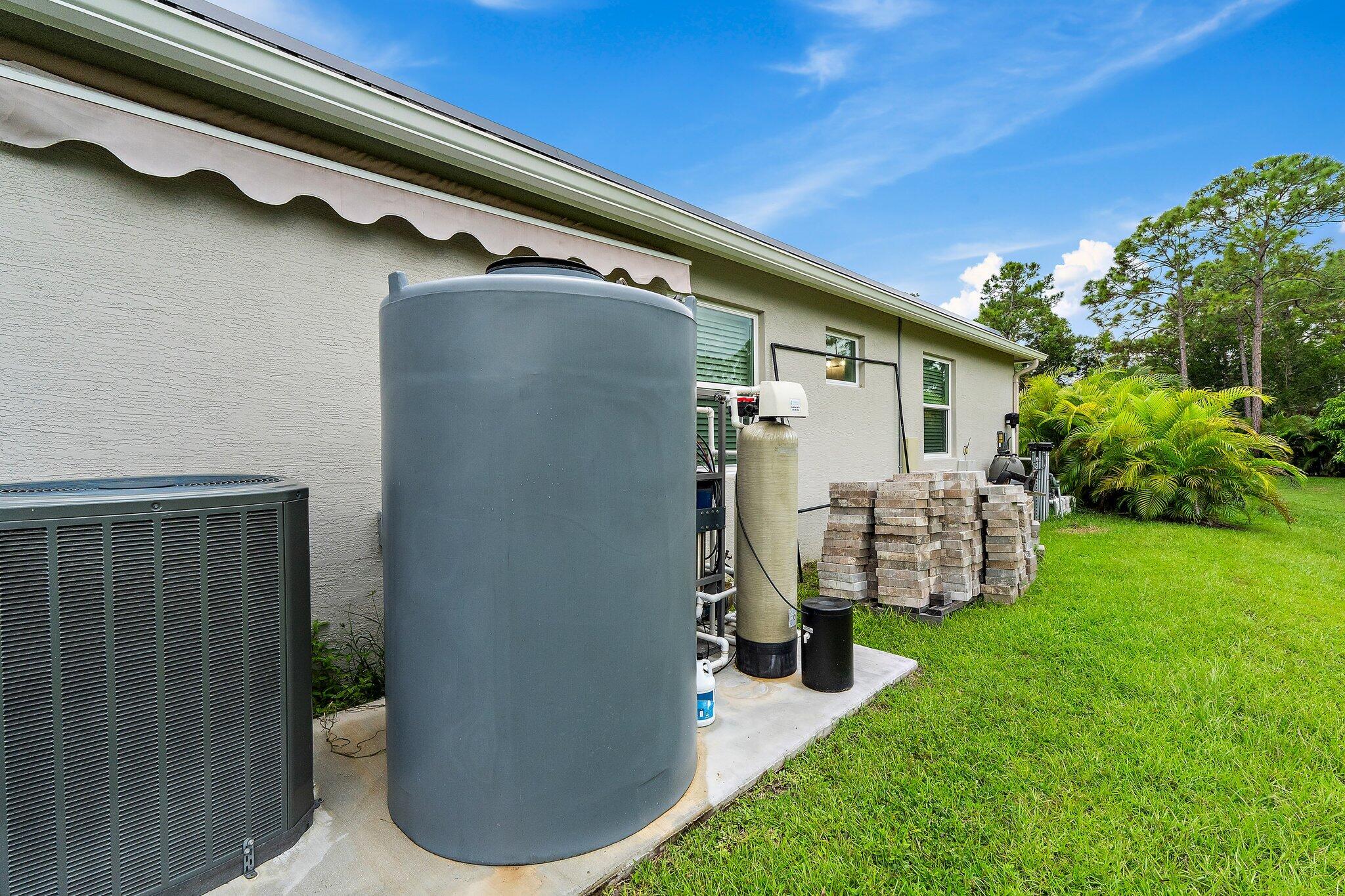 12216 175th Road North Jupiter, FL 33478 - Photo 54 of 57 a view of a backyard with plants and a patio