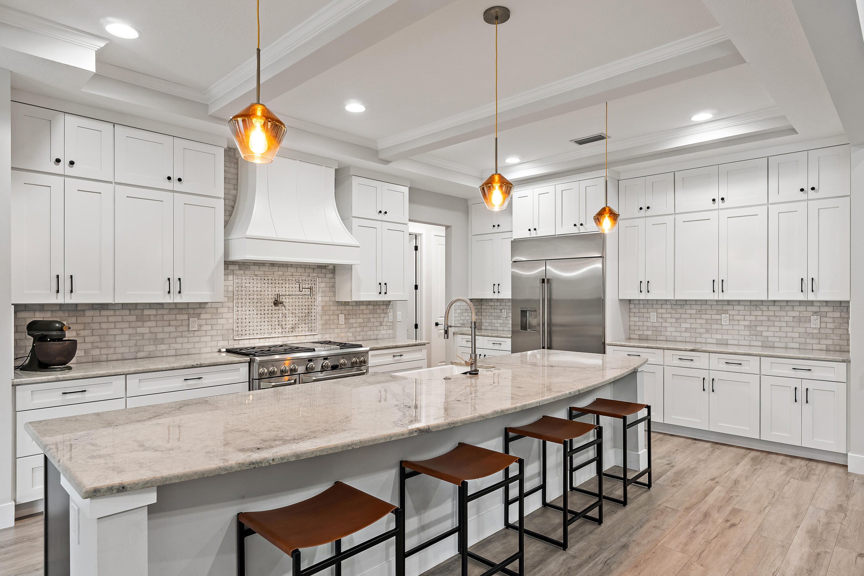12216 175th Road North Jupiter, FL 33478 - Photo 6 of 57 a kitchen with stainless steel appliances granite countertop a sink a stove and a refrigerator