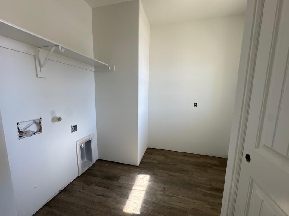 130 Fossil Canyon Drive Rhome, TX 76078 - Photo 11 of 15 a view of a hallway with wooden floor