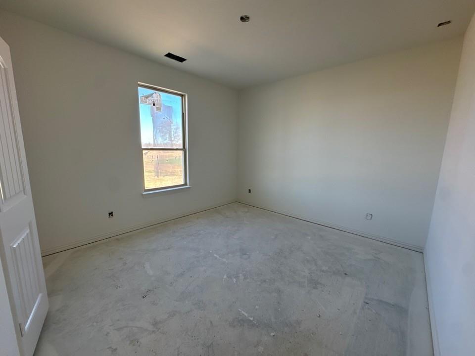 130 Fossil Canyon Drive Rhome, TX 76078 - Photo 13 of 15 an empty room with windows