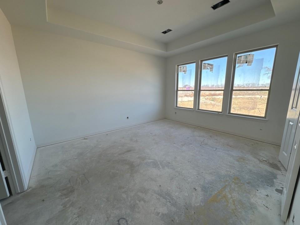 130 Fossil Canyon Drive Rhome, TX 76078 - Photo 9 of 15 a view of an empty room with a window