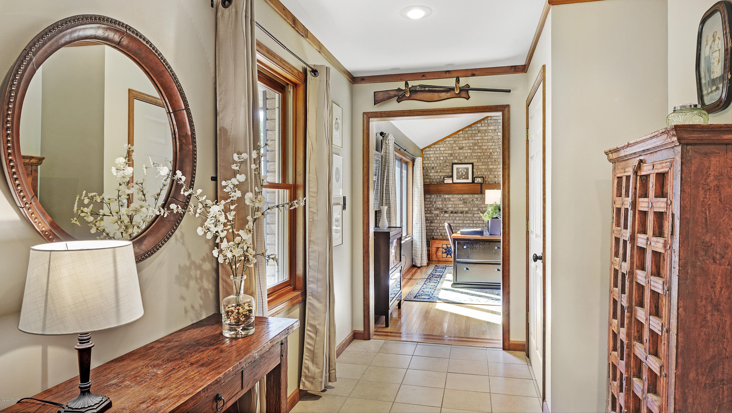 161 J J Road Moscow, PA 18444 - Photo 58 of 73 a view of an entryway with wooden floor and a mirror