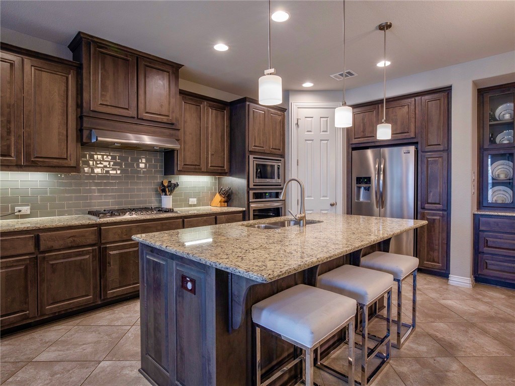 3401 Venezia View Leander, TX 78641 - Photo 15 of 40 Kitchen with Tons of Cabinet Space