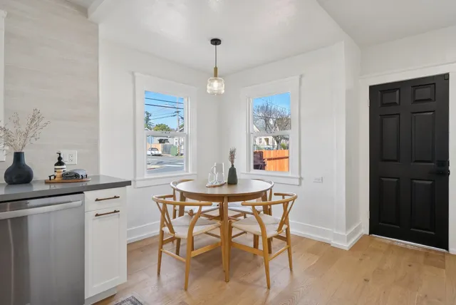 a dining room with furniture and window