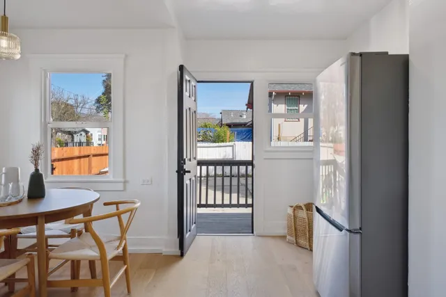 a view of kitchen with furniture and refrigerator