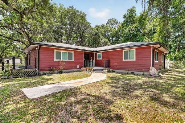 a view of a house with a yard