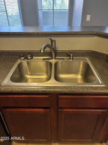 a close view of sink and granite counter top