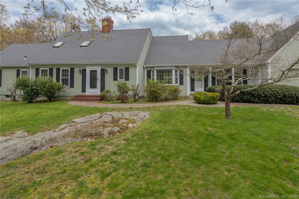 Nicely sited 3 bedroom cape with first floor master bedroom suite.