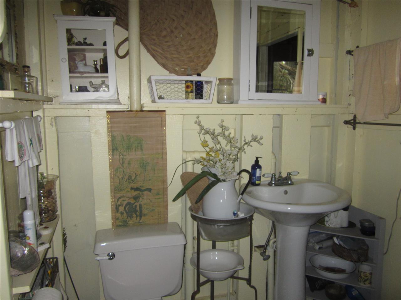 1085 West Kuiaha Road Haiku, HI 96708 - Photo 14 of 23 a bathroom with a sink and a mirror