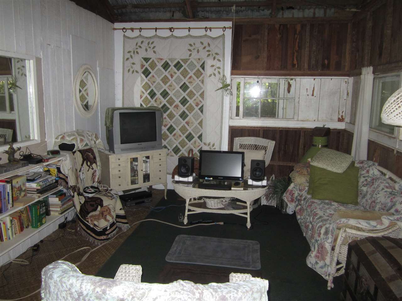 1085 West Kuiaha Road Haiku, HI 96708 - Photo 21 of 23 a living room with furniture a flat screen tv and a fireplace