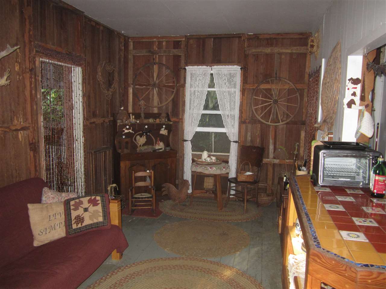 1085 West Kuiaha Road Haiku, HI 96708 - Photo 22 of 23 a living room with furniture and a fireplace