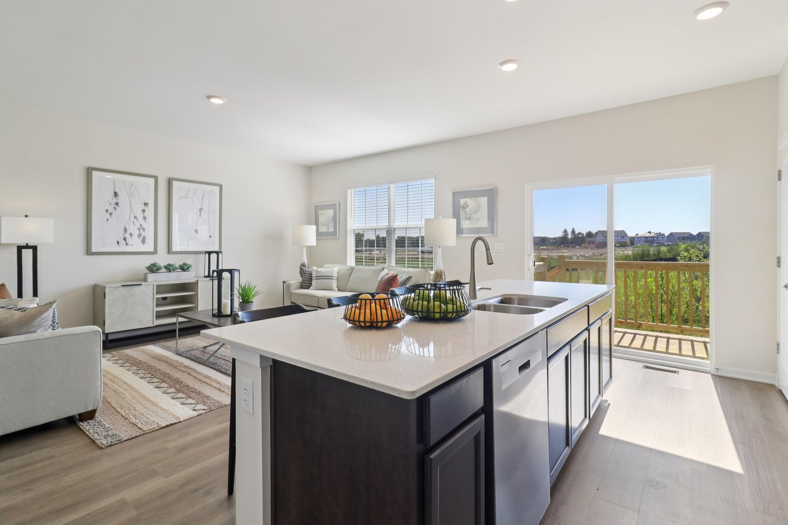 1744 Stable Lane Aurora, IL 60503 - Photo 12 of 34 a view of kitchen island a sink and living room with a large window