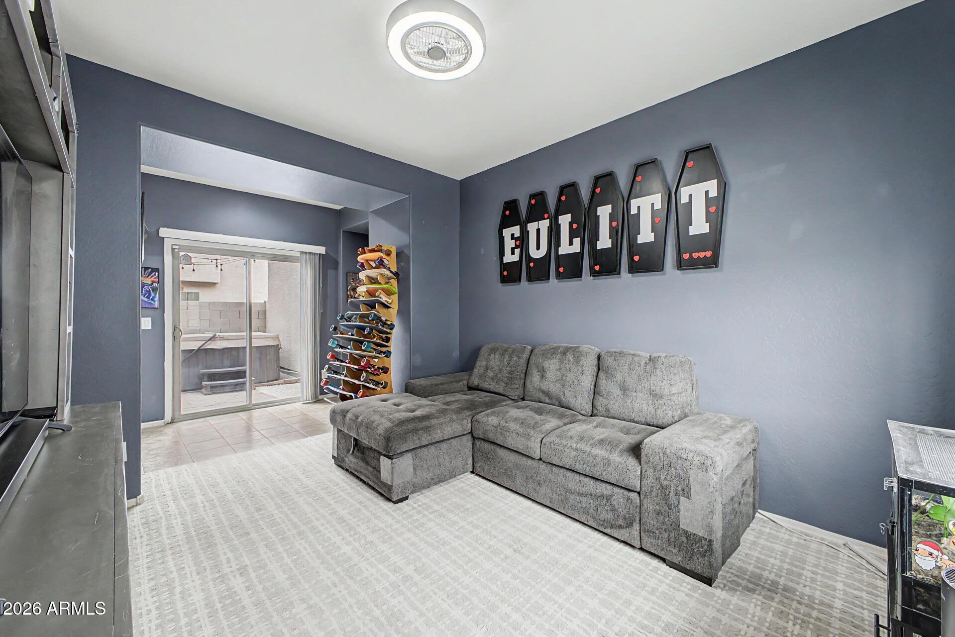 435 North Ranger Trail Gilbert, AZ 85234 - Photo 7 of 20 a living room with furniture and a flat screen tv