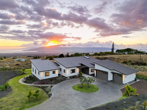 an aerial view of residential houses with wooden floor and city view