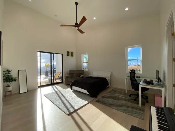 a bedroom with furniture and a window