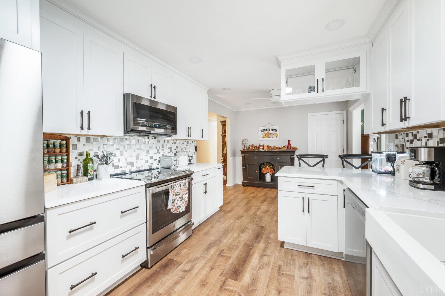192 Liberty Chapel Road Appomattox, VA 24522 - Photo 16 of 60 a kitchen with stainless steel appliances white cabinets a sink and a stove